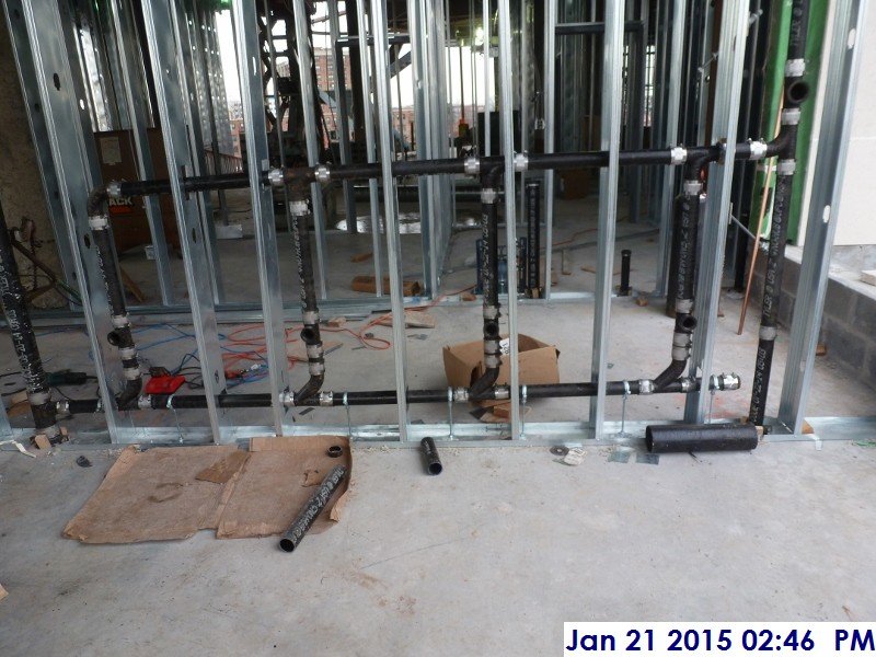 Installing Waste and Vent piping at the 3rd floor bathrooms Facing South